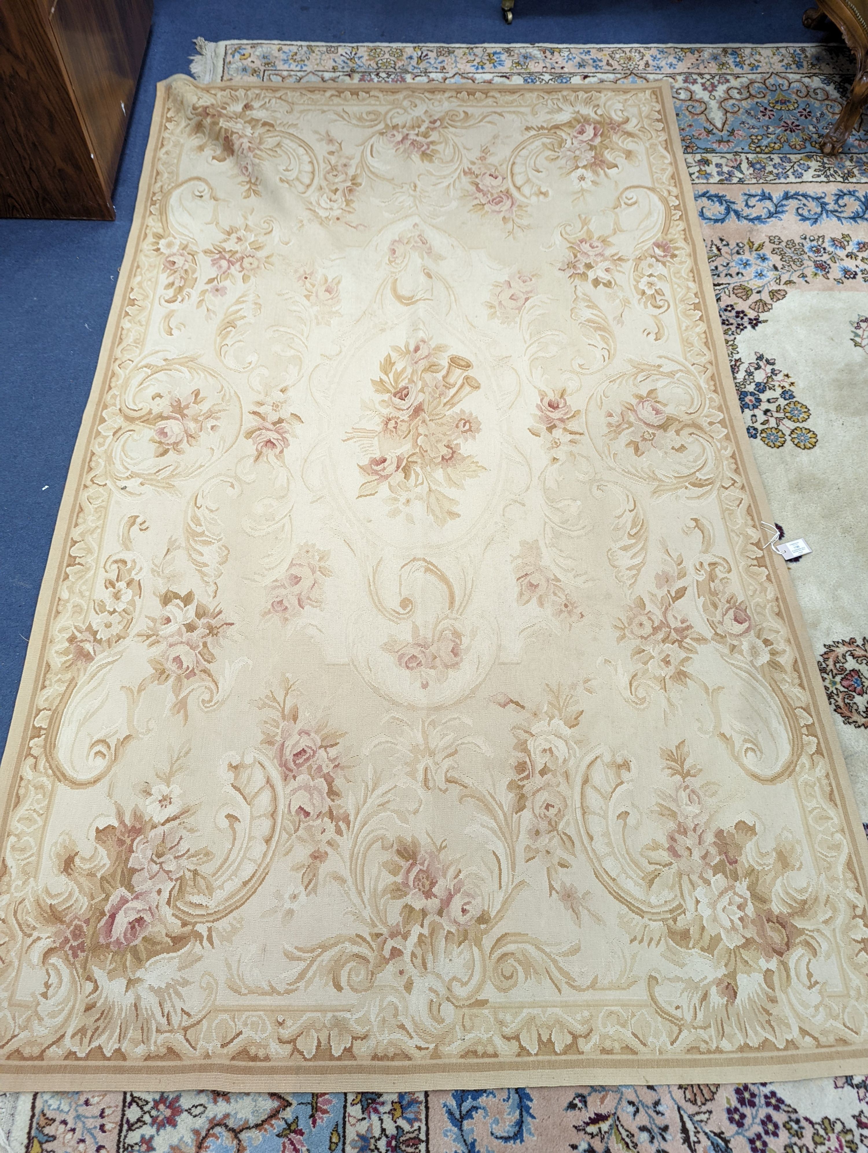 An Aubusson gold ground rug with rose pattern, 244 x 153cm